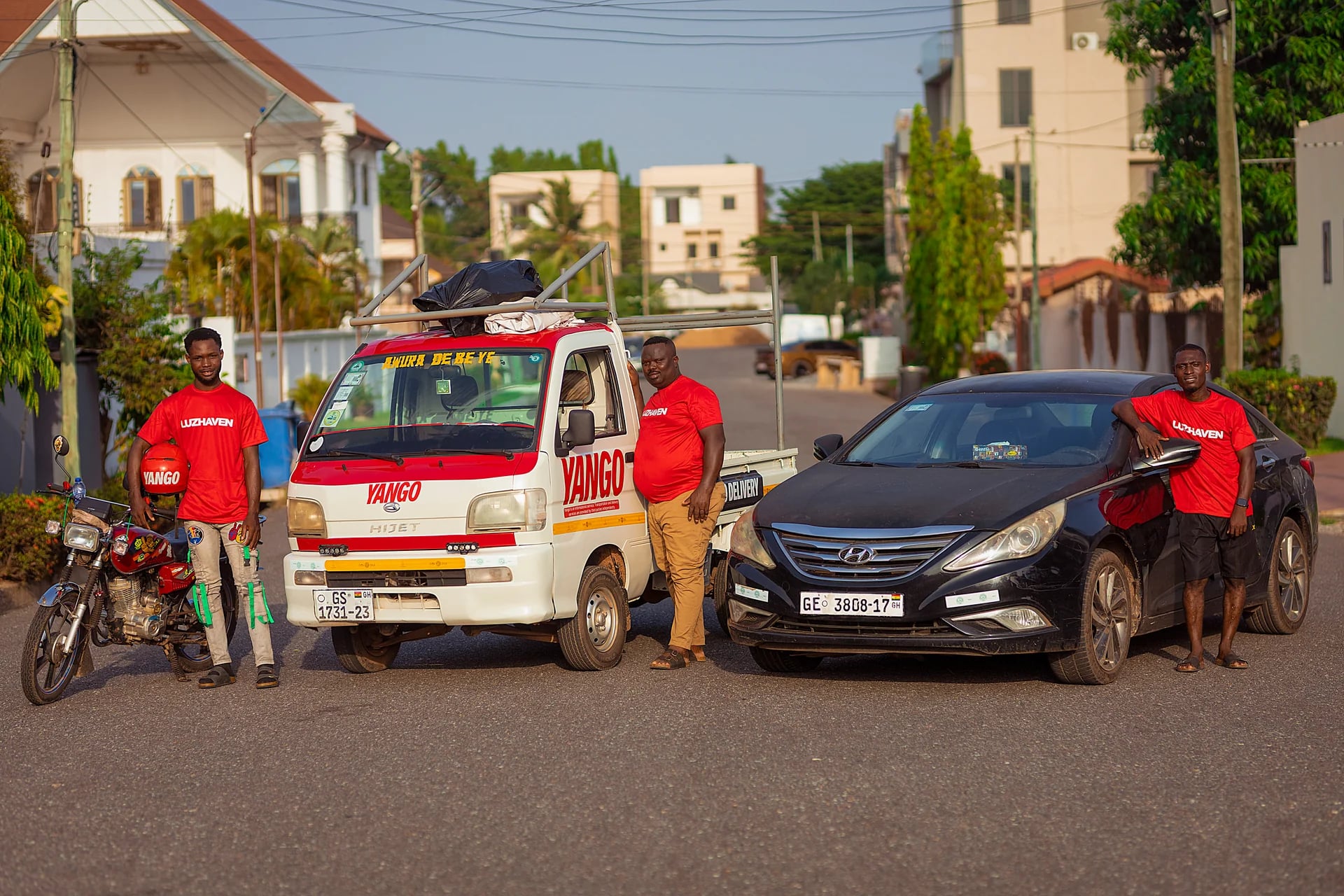 Happy Luzhaven drivers celebrating their success with branded gear and rewards